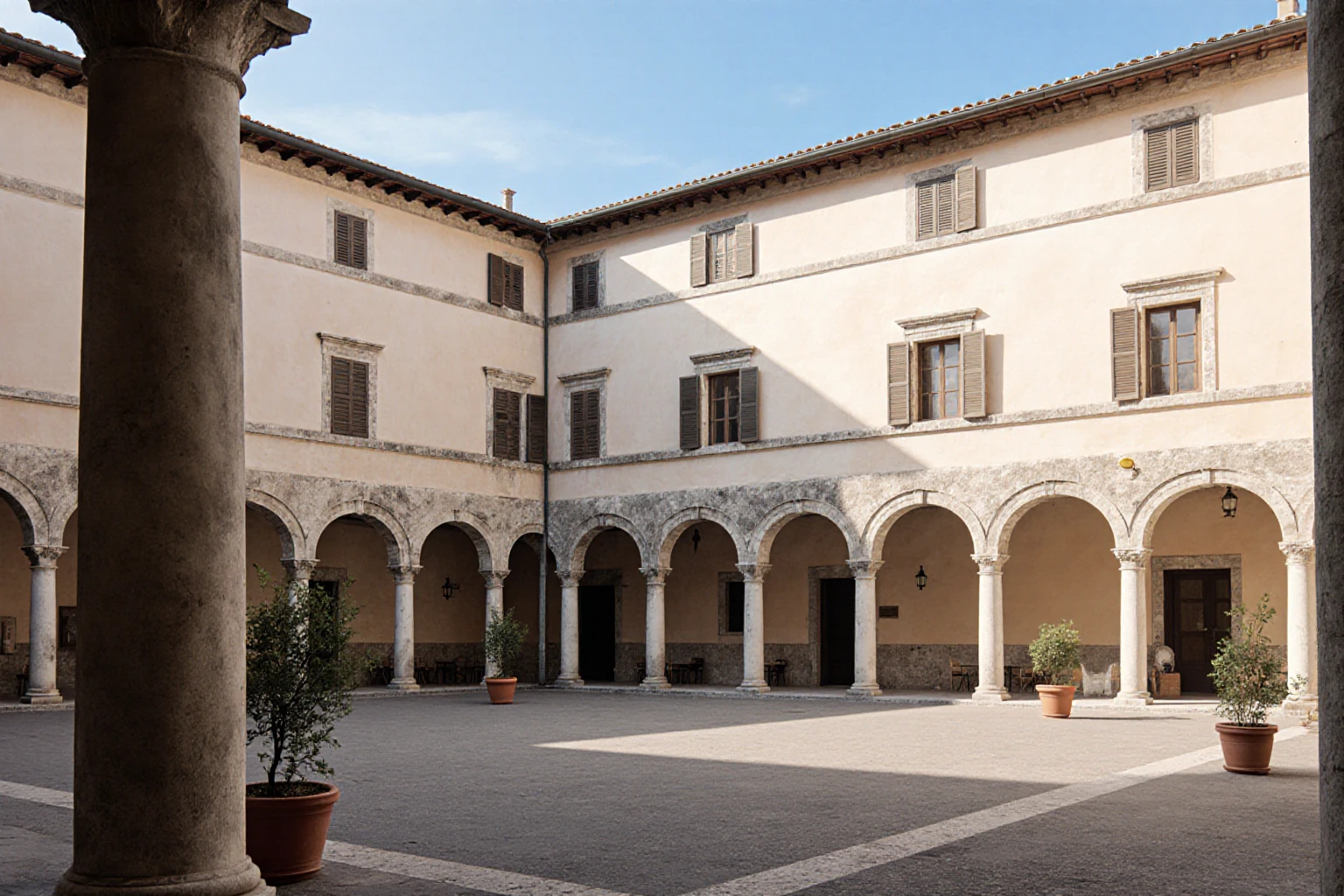 Historic Italian residential courtyard with a stone loggia